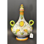 An Italian Firenze pottery twin handled wine bottle, serpent handles,