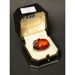 A large silver set amber Art Nouveau brooch,