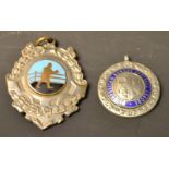 A silver football medallion and boxing fob