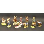 A Royal Doulton Bunnykins Fisherman, boxed; other, Boy Skater, Knockout, Tennis, Downhill, Home Run,