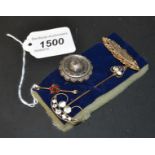 A Victorian gold faced brooch; a silver brooch; a scarf pin; etc.