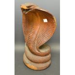 A 19th century Indian carved wooden cobra,