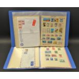 Stamps - Middle East stamps and postal history in two albums, including Abu Dhabi, Kuwait, Dubai,