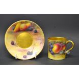 A Royal Worcester demitasse cup and saucer, ripe fruit, cup signed by H.G. Morley, saucer by H.