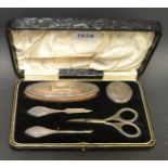 A five piece silver manicure set, cased.