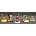 A Royal Doulton Mickey Mouse, MM1, gold back stamp; others, similar, Donald Duck, MM9; Pluto,
