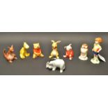 A set of eight Beswick Hundred Acre Wood figures , comprising, whiney the Pooh, Tigger,