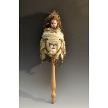 A 19th century French musical Marotte of a lady, bisque head, fixed brown eyes,