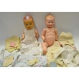 An Armand bisque baby doll, composite body, sleeping blue eyes, open mouth, two bottom teeth,