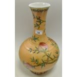 A Chinese globular vase, painted in polychrome with nine peaches on an extensive peach ground,