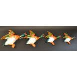 A set of four Beswick pottery flying Mallard wall plaques,no.