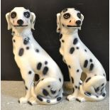 A pair of Dalmation ceramic floor standing dogs,