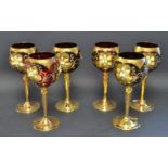 A set of six Murano glass red goblets, gilded and applied with flowers.