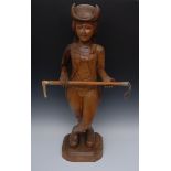 A 19th century carved hardwood shop display figure, standing,