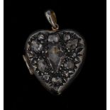 A diamond encrusted heart pendant locket, encrusted with thirteen irregular old cut diamonds,