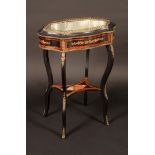 A 19th century French ebonised gilt metal mounted kingwood and marquetry shaped oval jardiniere