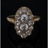 A fourteen stone diamond oval cluster ring,