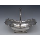 A George III silver shaped rectangular boat shaped swing-handled cake or bread dish,