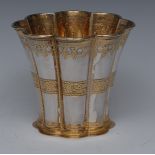 A Danish parcel-gilt silver flared fluted beaker, chased with bands of stiff leaves, gilt interior,