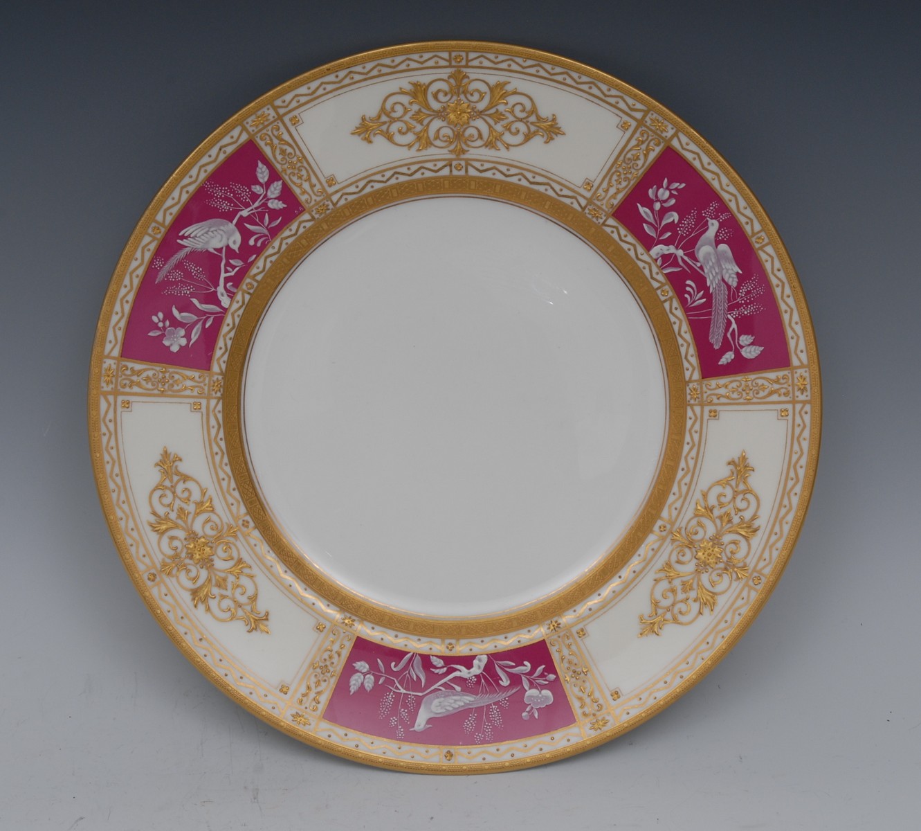A Mintons pate-sur-pate circular plate, the borders with alternating panels,