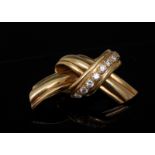 A diamond and 18ct gold ribbon knot brooch,