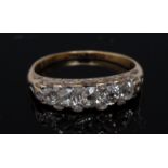 A diamond five stone ring, set with five principle old cut graduated diamonds,