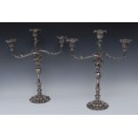 A pair of Rococo Revival electro-plated three-light table candelabra, campana sconces,