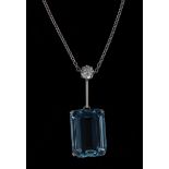 An aquamarine and diamond pendant necklace, rectangular baguette cut aquamarine, approx 16.