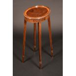 A George III Revival satinwood crossbanded mahogany oval kettle stand, wavy gallery,