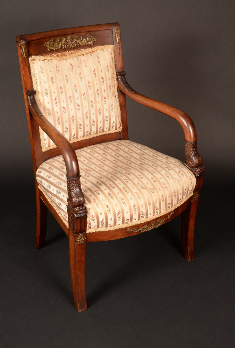 A French gilt metal mounted mahogany elbow chair, curved rectangular back,