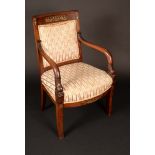 A French gilt metal mounted mahogany elbow chair, curved rectangular back,