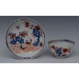 A Lowestoft tea bowl and saucer, painted in underglaze blue, iron red and gilt, in 'Redgrave' style,