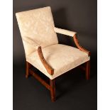 A George III design mahogany Gainsbourgh armchair, stuffed-over cream Damask upholstery,