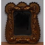 A 19th century giltwood and gesso shaped rectangular looking glass, bold acanthus border,