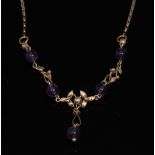 An amethyst and 9ct gold necklace, 9ct gold openwork knotted link crest,