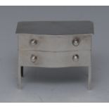 Asprey - a rare Edwardian silver novelty four section stamp box, as a serpentine commode,