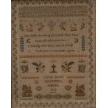 A Victorian needlework sampler, embroidered by Louisa Busby, Berkswell School, 1863, with alphabet,