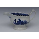 A Liverpool sauce boat, decorated in underglaze blue with fishermen, to front and verso,