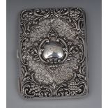 A Victorian rounded rectangular silver card/aide-memoire, embossed with scrolls,
