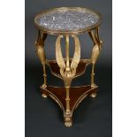 A French Empire gilt bronze and mahogany circular guéridon, grey vein marble top,
