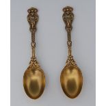 A pair of rare Victorian silver-gilt Rich Figure pattern spoons, 18cm long, Francis Higgins II,