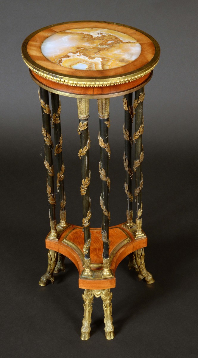 A 19th century French parcel gilt, patinated bronze and satinwood gueridon, by Alix a Paris,