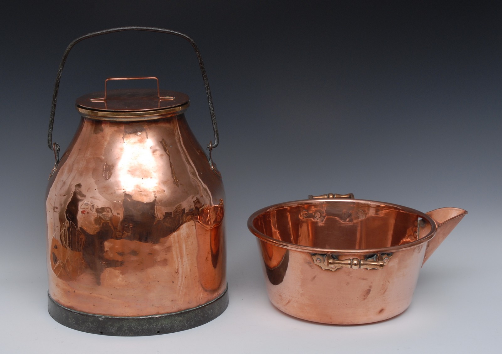 A 19th century copper milk churn and cover, swing handle, 42cm high, c.