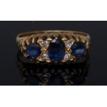 An Edwardian seven stone sapphire and diamond ring,