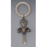 A George V silver novelty baby's rattle, embossed with the head of a boy, double-sided,