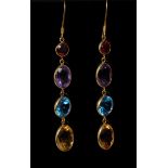 A pair of multi stone articulated drop earrings, each set with a circular red garnet,