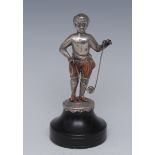 A 19th century silver coloured metal miniature figure, of a scantily clad boy playing with a diablo,