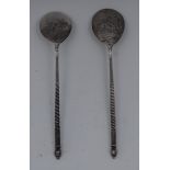 A pair of Russian silver caviar spoons,