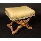 A 19th century giltwood X-frame stool, stuffed-over seat,