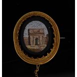 A 19th century Italian micromosaic brooch, oval panel depicting a Roman Portico arch, black mount,